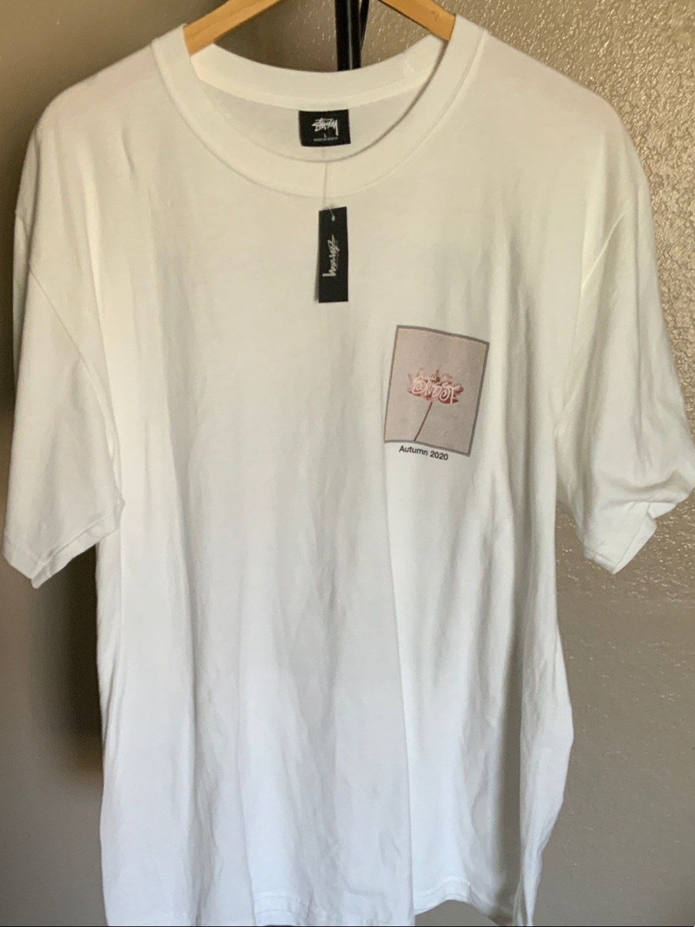 Stussy White Short-Sleeve Tee with Pink Pocket Graphic